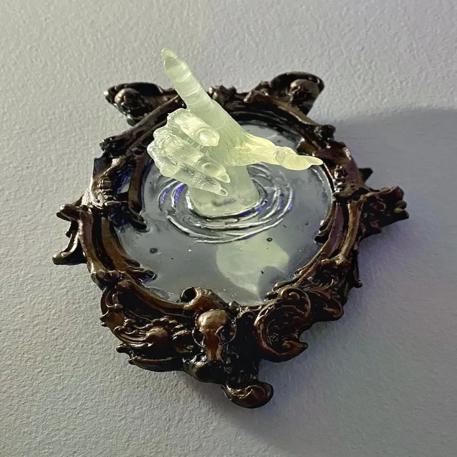 Spooky Wall Sculptures Ofvictorian Ghosts Emergingfrom A Mirror