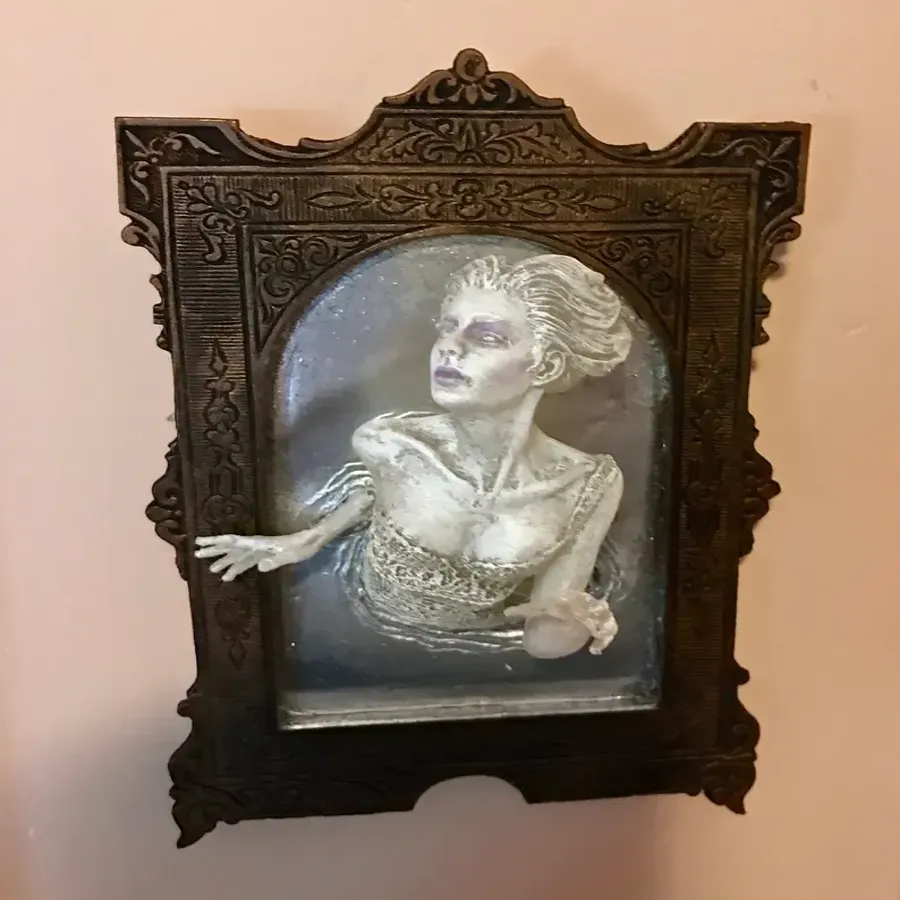 Spooky Wall Sculptures Ofvictorian Ghosts Emergingfrom A Mirror